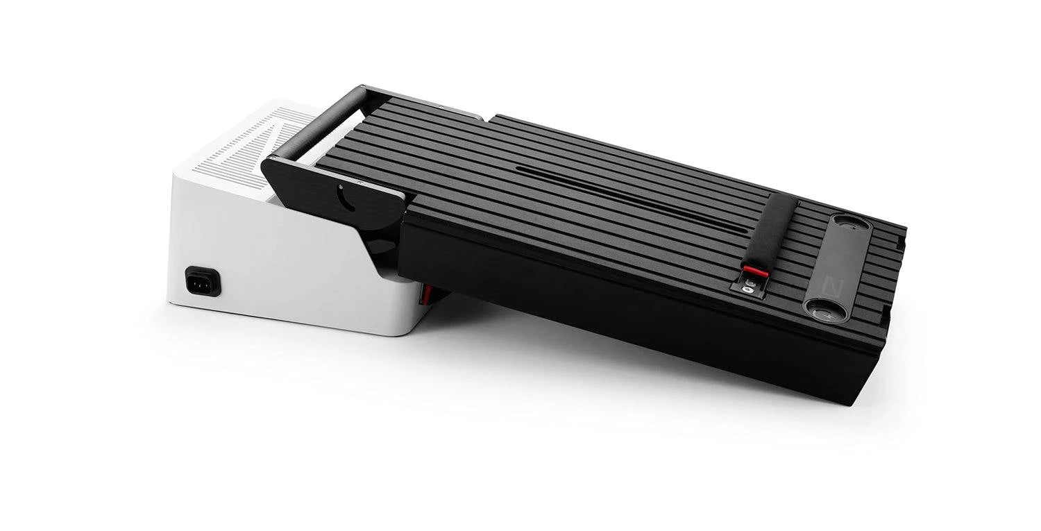 Awake RÄVIK and VINGA Flex Battery with battery charger - top view. Ships free at e-boarders.com
