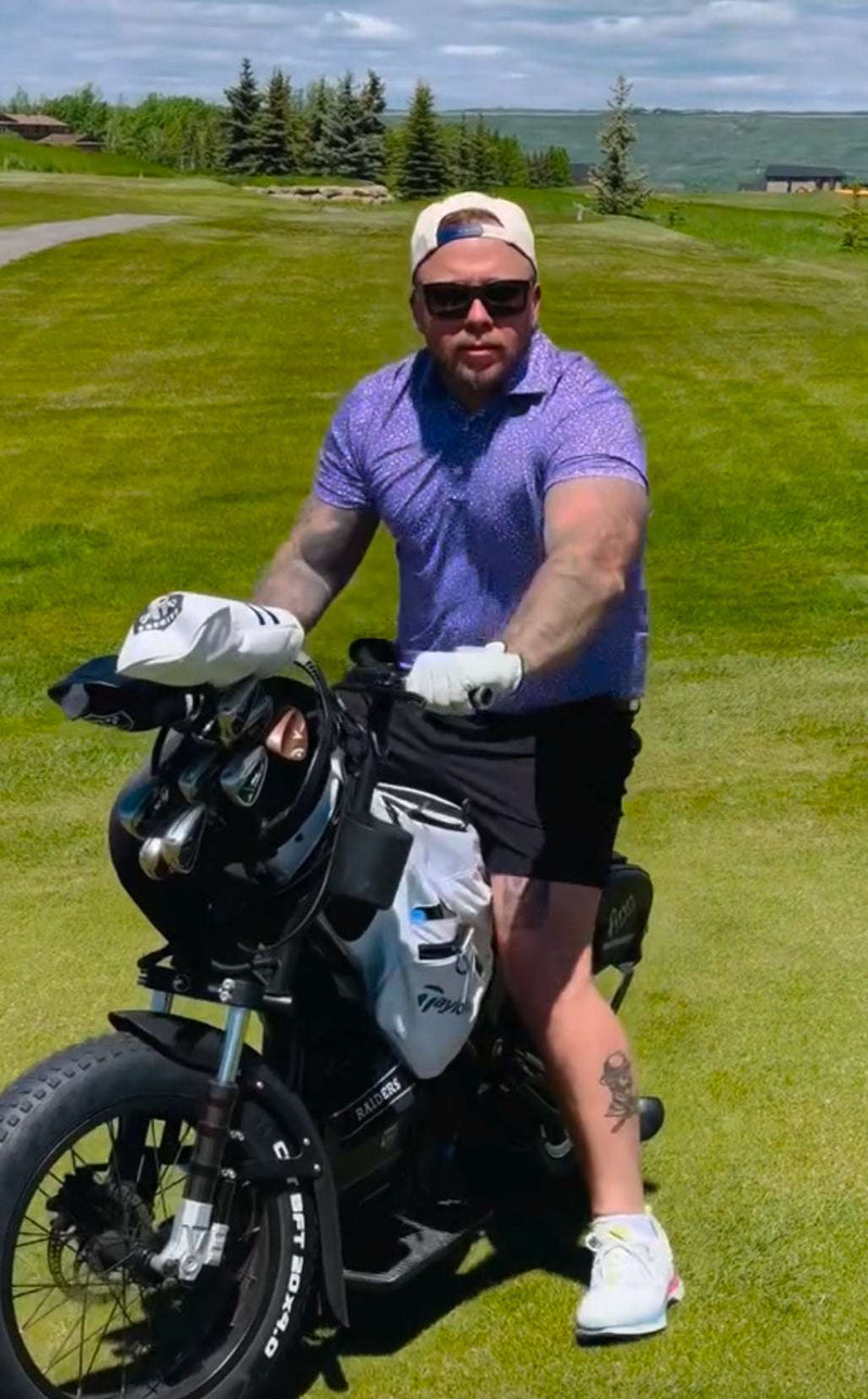 Male golfer on fairway golf course with golf bag and Eahora M6G Electric Golf Caddy for golfers. Free shipping at E-Boarders.com