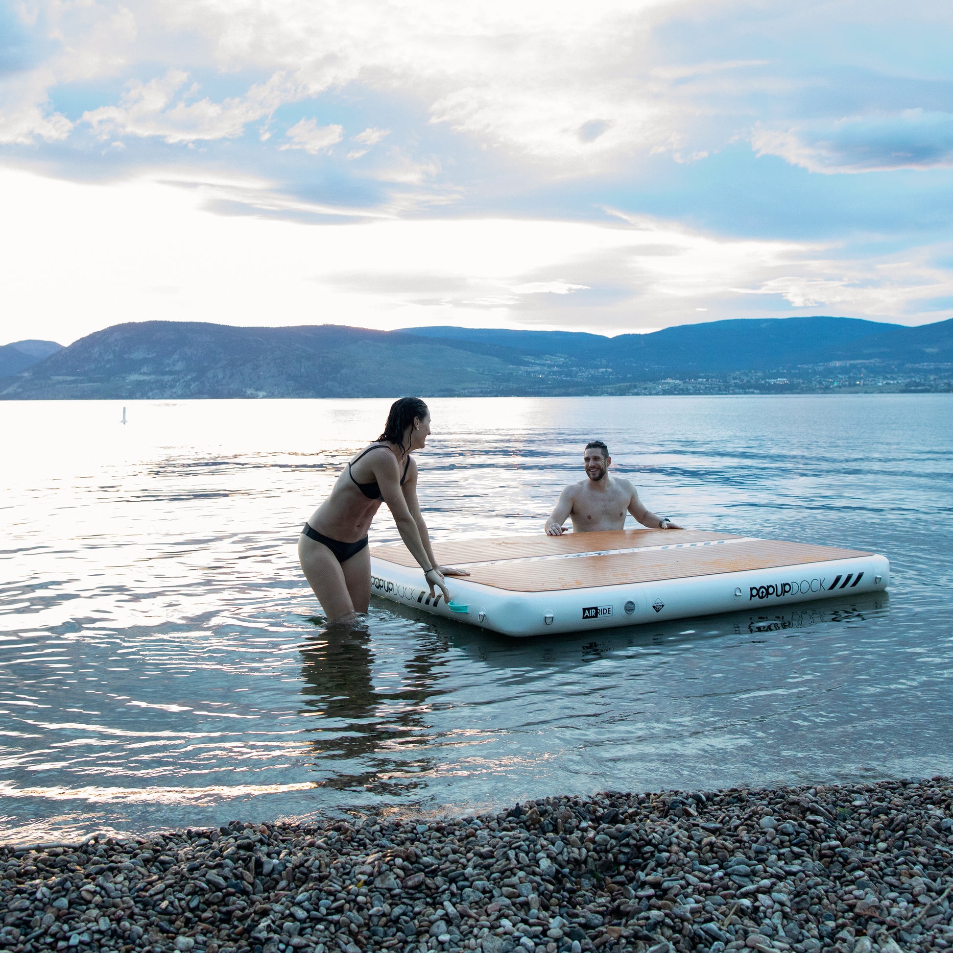 PopBoard inflatable dock and swimmers in the water