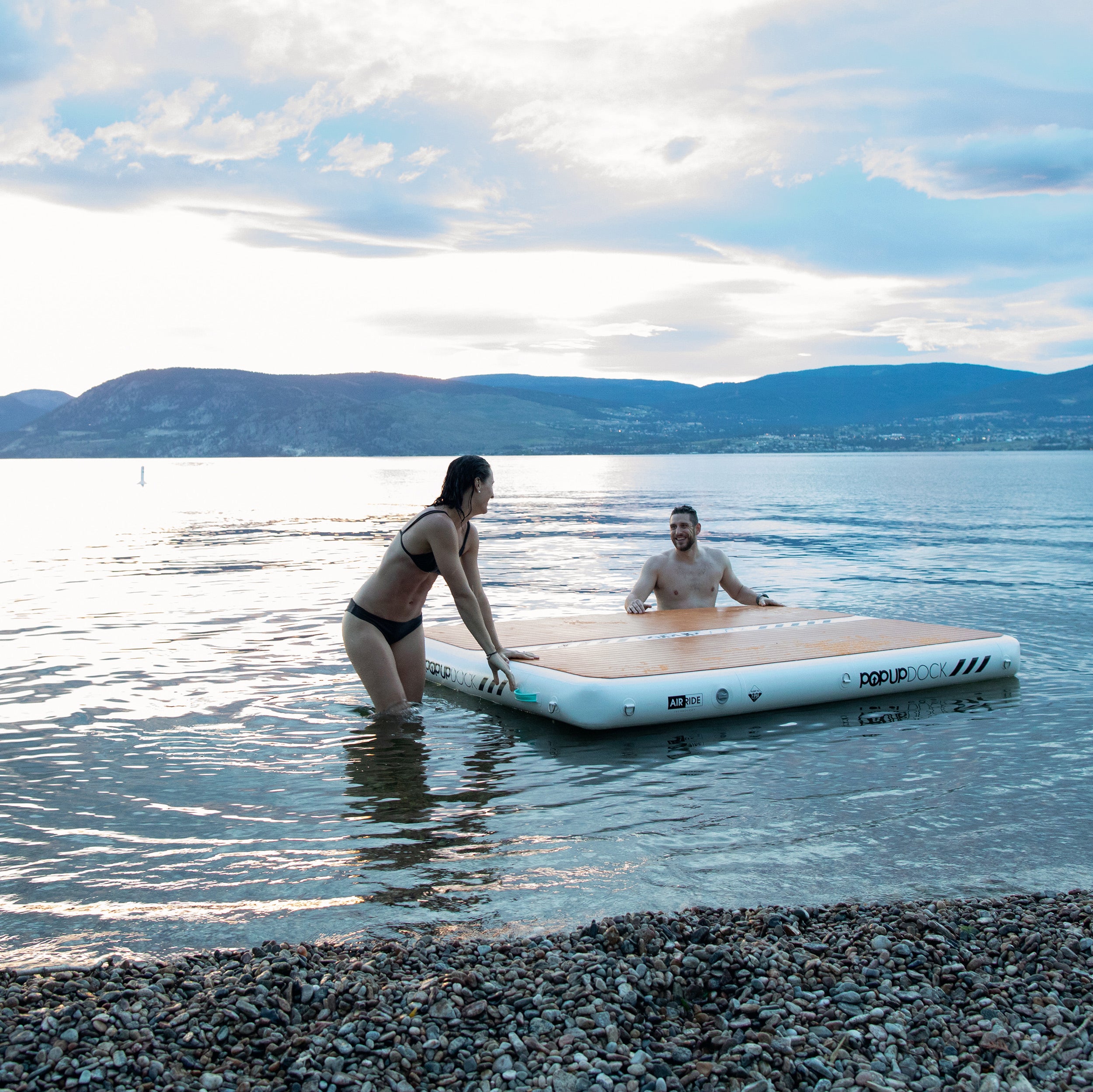PopBoard inflatable dock and swimmers in the water