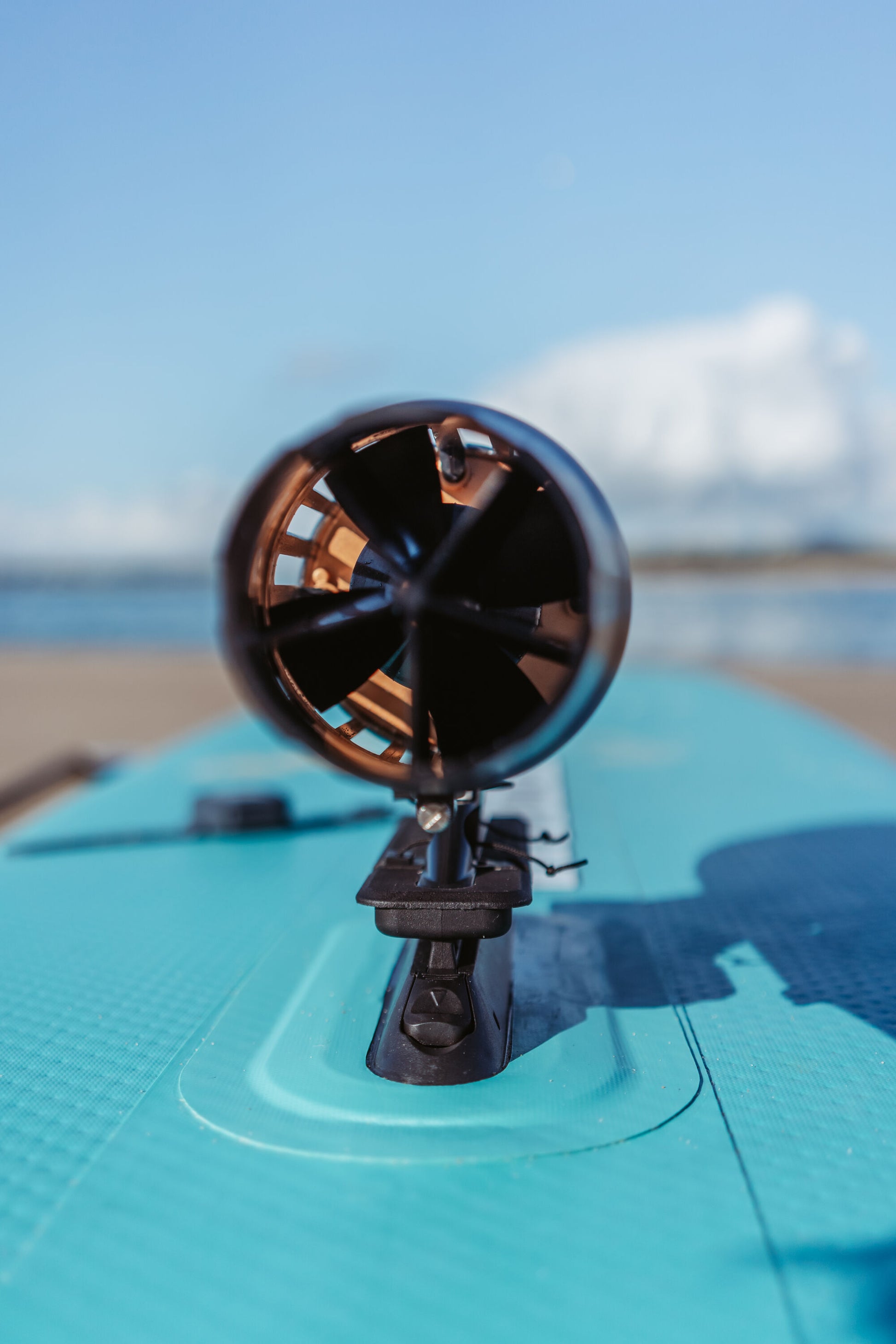 Aqua Marina BLUEDRIVE X Pro electric-assist fin system mounted to paddleboard middle fin adaptor. Free shipping at e-boarders.com