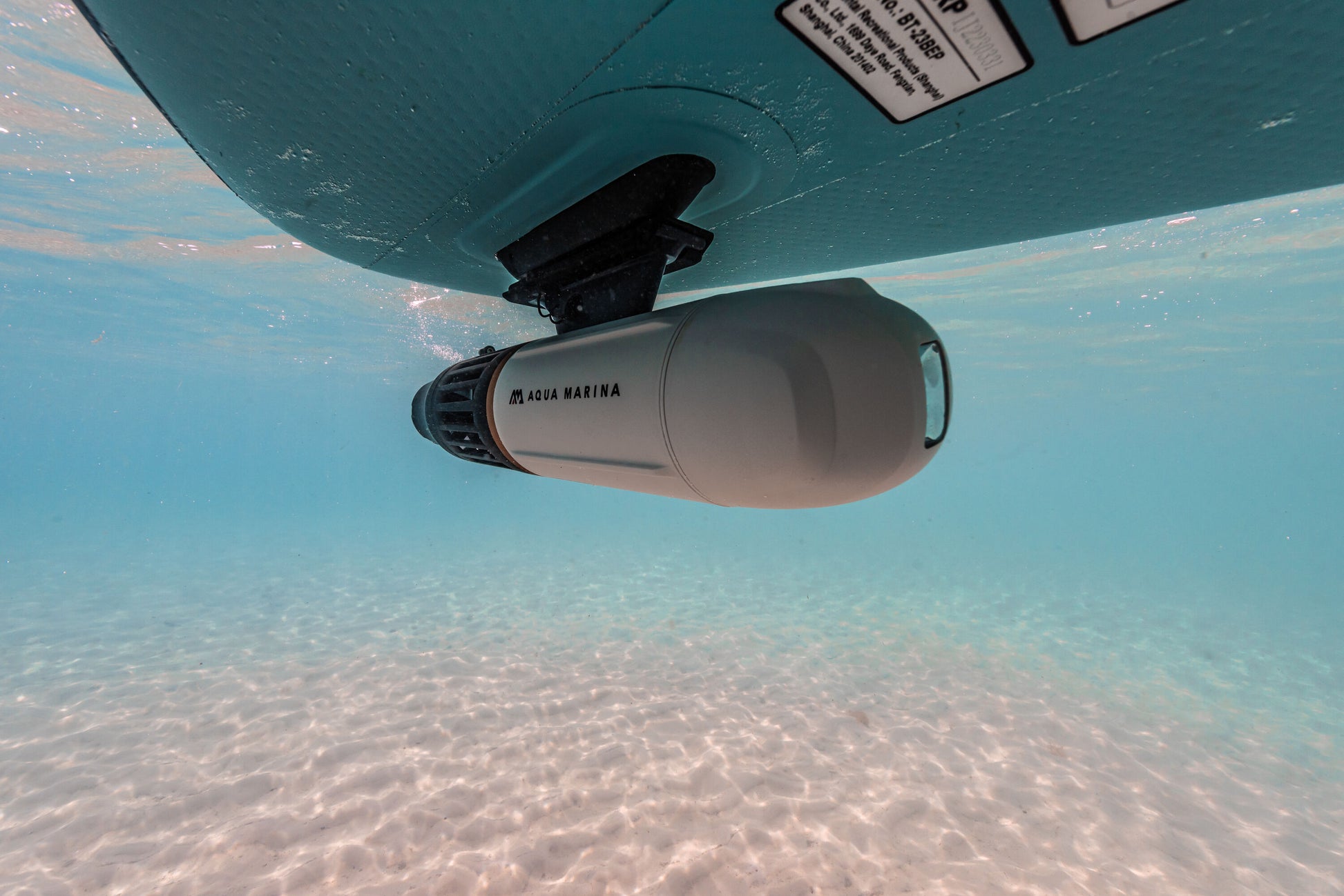 Aqua Marina BLUEDRIVE X Pro mounted underwater to paddleboard middle fin adaptor. Free shipping at e-boarders.com