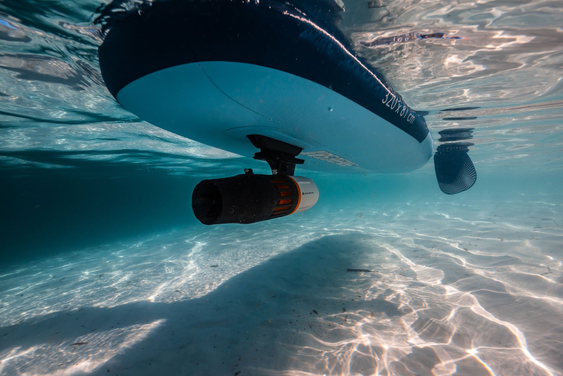 Aqua Marina BLUEDRIVE X Pro mounted underwater to paddleboard middle fin adaptor. Free shipping at e-boarders.com