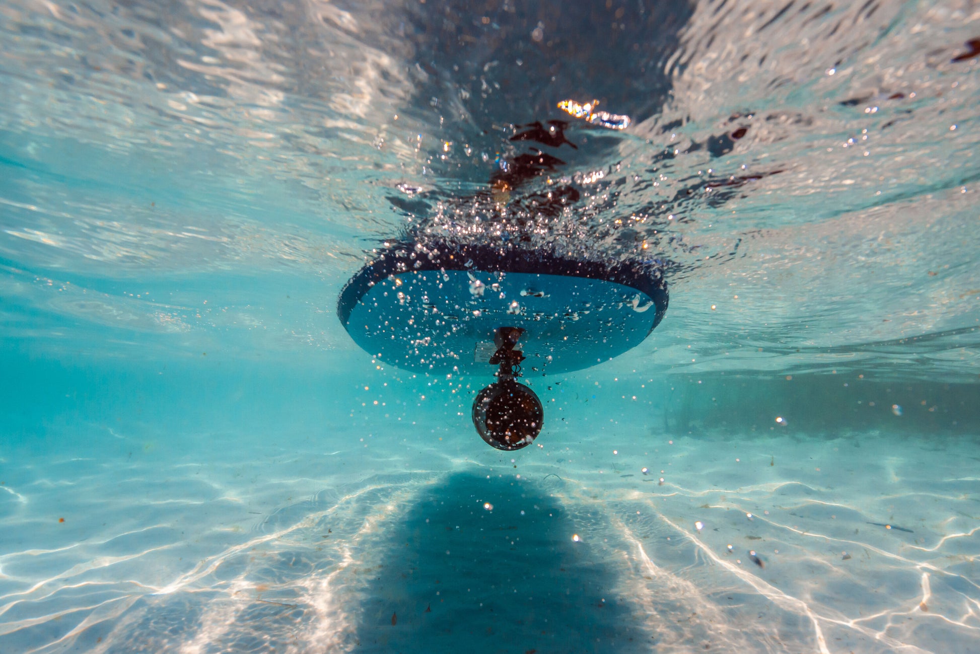 Aqua Marina BLUEDRIVE X Pro mounted underwater to paddleboard middle fin adaptor. Free shipping at e-boarders.com