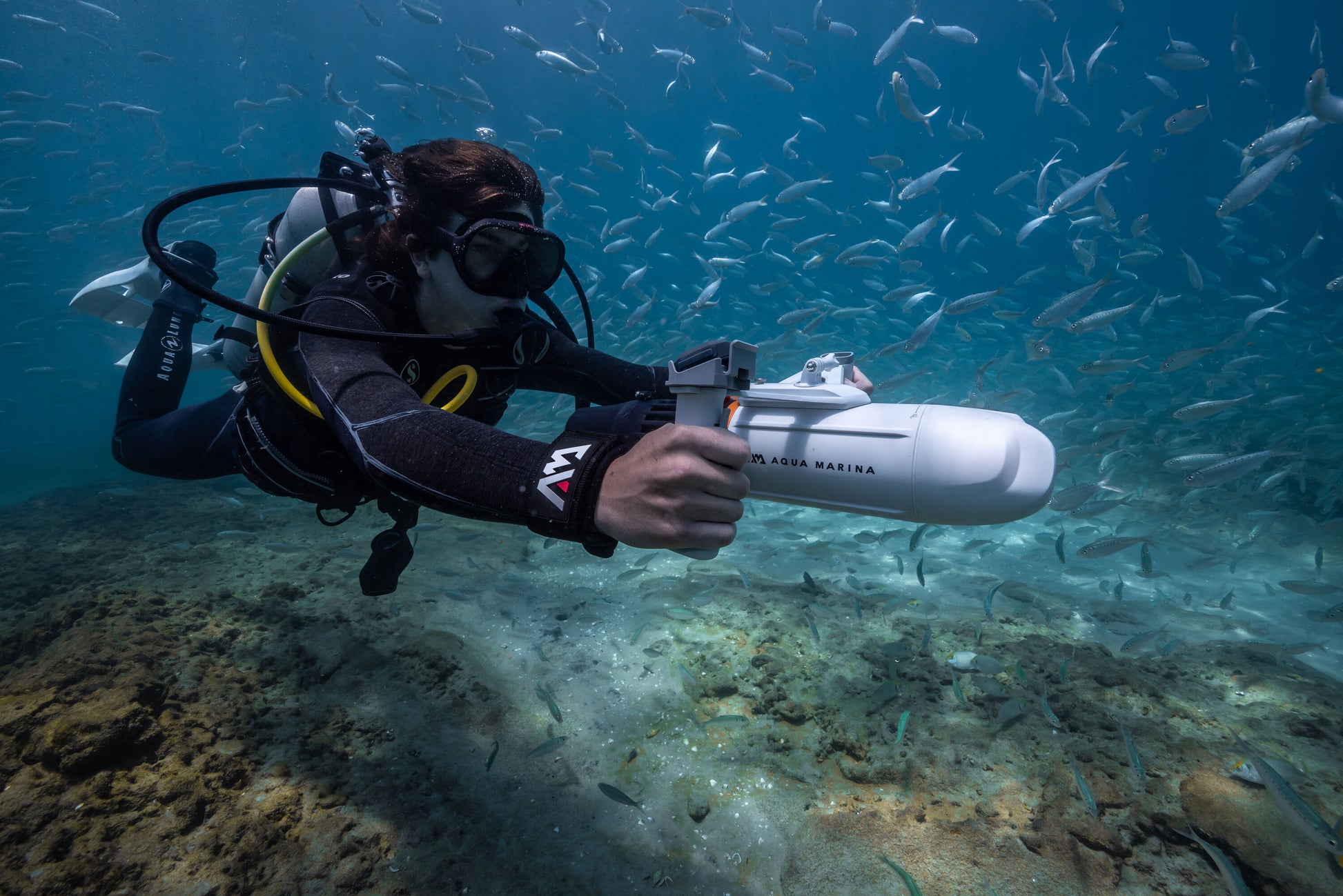 Diver swimming with Aqua Marina BLUEDRIVE X Pro electric-assist fin system. Free shipping at e-boarders.com