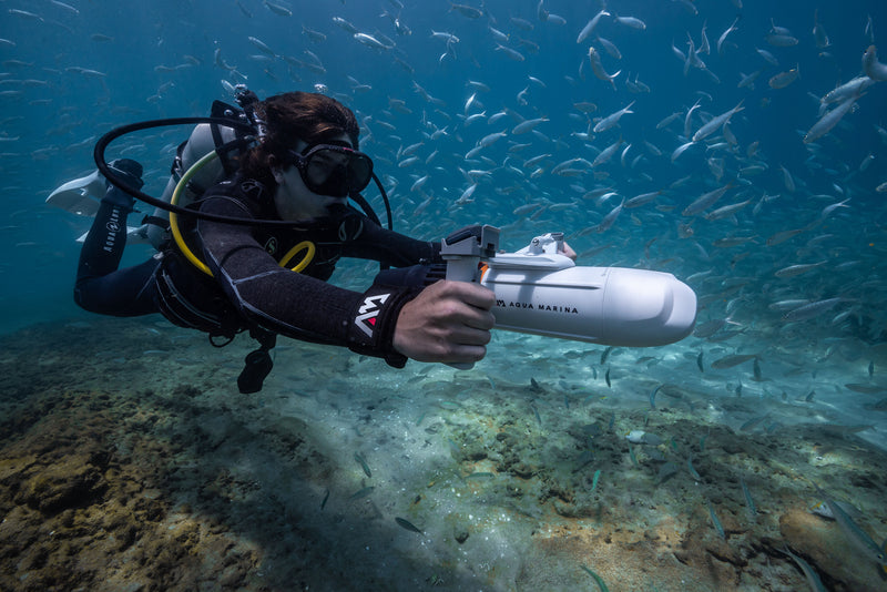 Diver swimming with Aqua Marina BLUEDRIVE X Pro electric-assist fin system. Free shipping at e-boarders.com