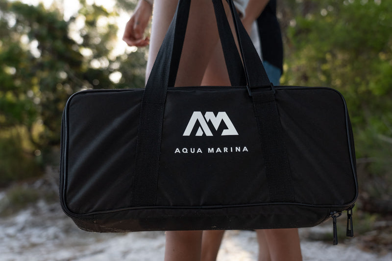 Travel bag included with Aqua Marina BLUEDRIVE X Pro electric-assist fin system. Includes wireless remote control and rechargeable battery. Designed for paddleboarders, snorkelers, and recreational swimming. Free shipping at e-boarders.com