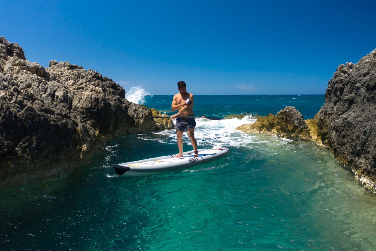 Lifestyle photo man on Aqua Marina Drift iSUP with rod holder — ships free at e-boarders.com