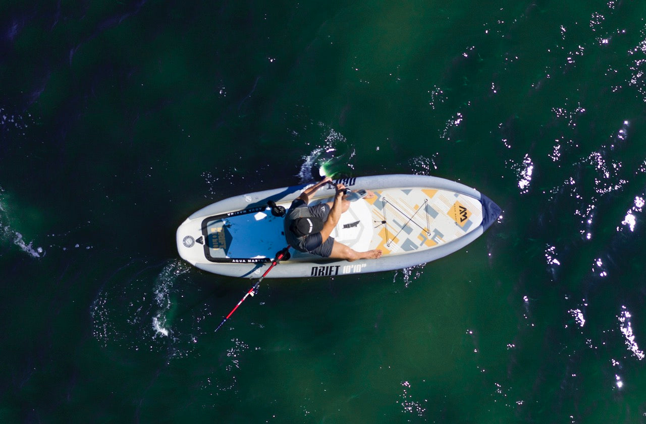 Lifestyle photo man on Aqua Marina Drift iSUP with rod holder — ships free at e-boarders.com