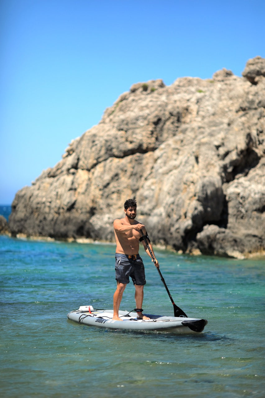 Lifestyle photo man on Aqua Marina Drift iSUP with rod holder — ships free at e-boarders.com
