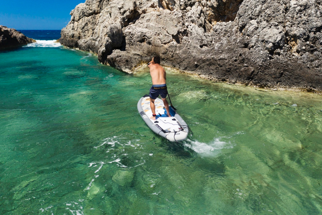 Lifestyle photo man on Aqua Marina Drift iSUP with rod holder — ships free at e-boarders.com