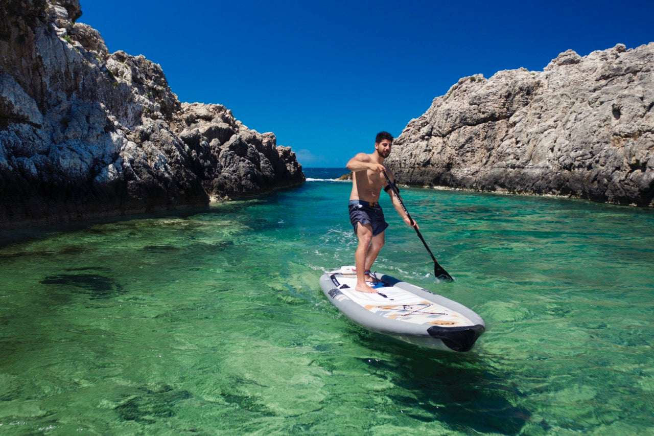 Lifestyle photo man on Aqua Marina Drift iSUP with rod holder — ships free at e-boarders.com