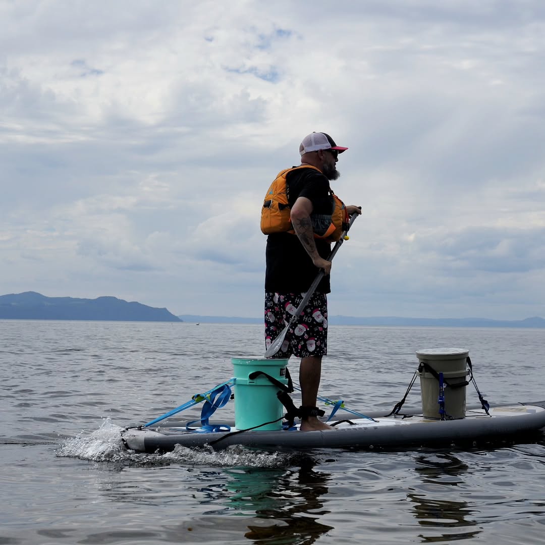 Lifestyle photo man paddling on Aqua Marina Drift iSUP with rod holder — ships free at e-boarders.com