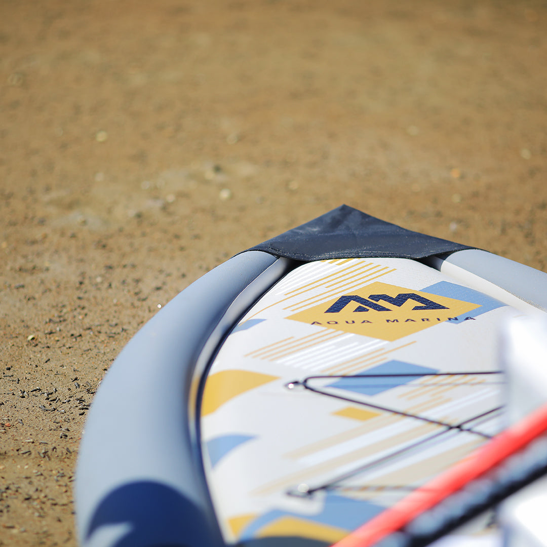 Lifestyle photo front tip of paddlboard Aqua Marina Drift iSUP with rod holder — ships free at e-boarders.com