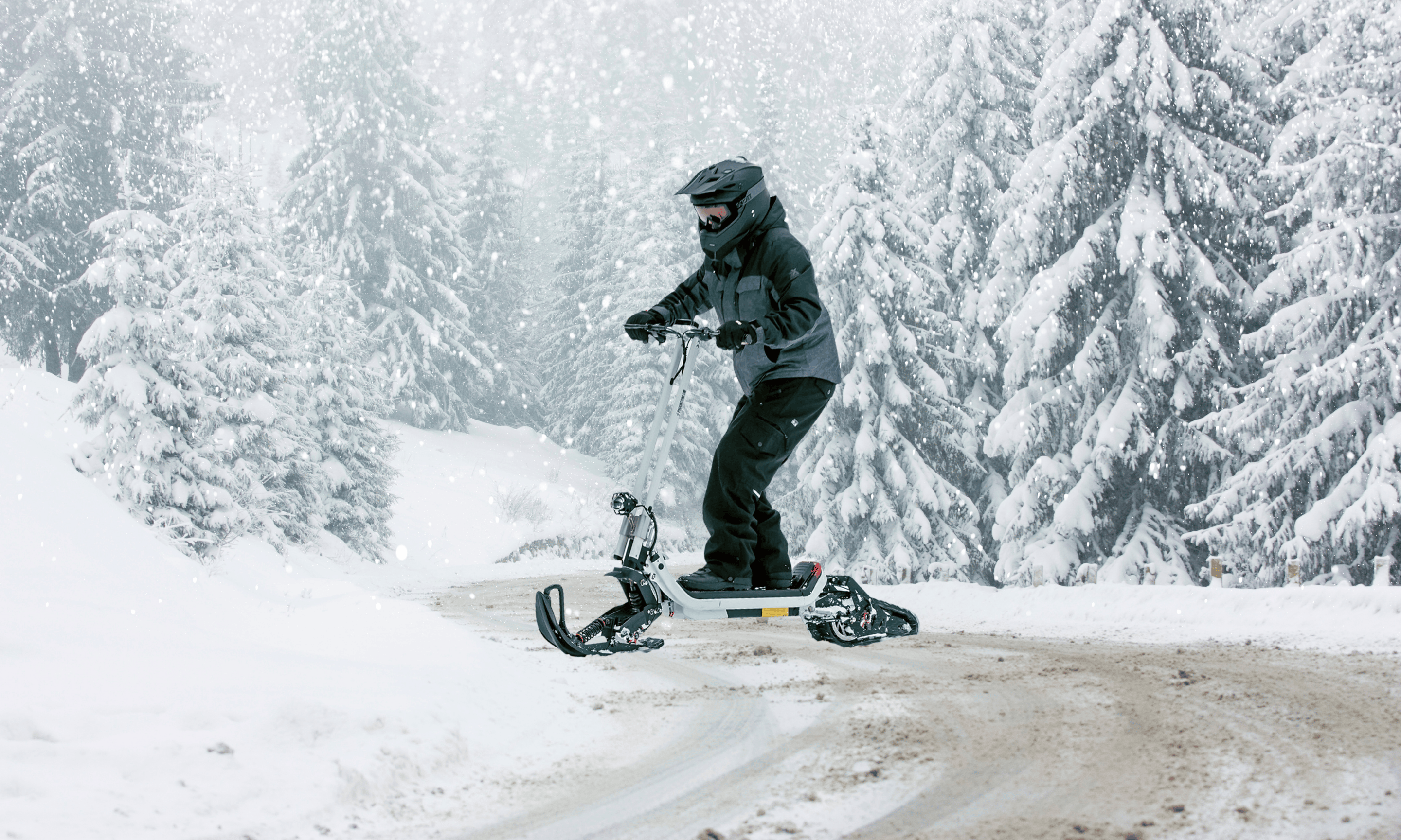 Phantom GoGo G63 All-Terrain Off-Roading Snow-Mobile Electric Scooter riding through the snow. Available at E-Boarders.com