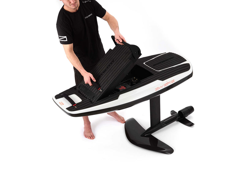 e-boarders-eboarders-awake-ravik-vinga-board-bag-kit-wall-mount-custom-battery-charger-powerkey-ravik-vinga-jetboard-efoil-standard-range-extended-range-watersports-water-sports-electric-wakeboard-surfboard-ejetboard-efoil-ewakeboard-epaddleboard-eboard-man-pulling-boardbag